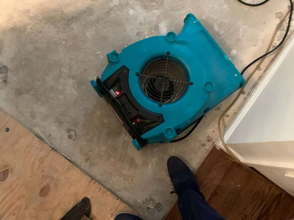 Air mover drying subfloor during Leak Detection & Repair in The Villages